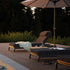Kirra Sunbed in Kirra Sand color with adjustable backrest and powder-coated aluminum frame outdoors.