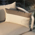 Sand and indigo color block outdoor cushion with removable cover on lounge furniture.