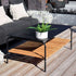 Outdoor patio sofa table with black powder-coated aluminum frame and teak wood shelf underneath