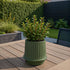 Olive ceramic Gaia 16 outdoor planter with matte fluted surface and drainage hole, inspired by ancient Greece.