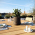 Mocca ceramic Gaia 16 outdoor planter with matte fluted surface and drainage hole
