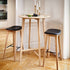 Nordic bar stool in oak with Terra Black leather seat and powder-coated steel footrest.