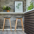 Nordic bar stool in oak with Luna Carbon leather upholstery and matching cross-stitching detail.