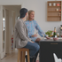 Nordic bar stool in Terra Black leather with oak wood frame and cross-stitch details