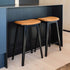 Nordic bar stool in black stained oak with Terra Black leather upholstery and cross-stitch details.