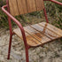 Kirra Patio Chair in chestnut with teak wood and powder-coated aluminum frame outdoors