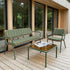 Green back cushion fitted to a Kirra patio bench on a wooden deck beside a matching outdoor chair and coffee table in a Nordic woodland setting from sackit