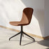 Black Chair no. One S1 with swivel base and leather upholstery, simple and modern dining chair design.