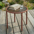 Chestnut Mollis Side Table Ø50 with powder-coated aluminum frame and smoked tempered glass top outdoors