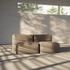 Soft indoor two seater sofa in warm beige with rounded boneless cushions in a sunlit modern room by sackit