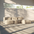 Beige indoor modular sofa and pouf set with soft rounded forms in a sunlit room designed by sackit for relaxed Nordic living