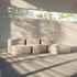 Cream modular indoor sofa with rounded cushions and matching pouf in a sunlit modern room with tree shadows from sackit