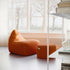 SACKit Chair and Pouf Indoor in orange jacquard fabric with soft, rounded shapes for cozy living spaces