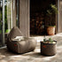 Cobana Lounge Chair and Pouf in Cobana Grey with rounded shapes and soft fabric texture.