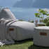 Cobana Lounge Chair and Pouf in Cobana Grey with soft fabric and rounded shapes on a plain background