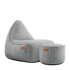 Cobana Lounge Chair and Pouf in Cobana Sand Melange with soft fabric texture and rounded shapes.