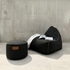 Cobana Lounge Chair and Pouf in Cobana Grey with soft fabric and rounded shape.