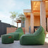 Cobana Lounge Chair and Pouf in Cobana Grey with soft, rounded design and durable fabric.