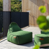Cobana Lounge Chair and Pouf in Cobana Grey with rounded shapes and soft fabric texture