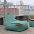 Cobana Lounge Chair and Pouf in Cobana Grey with rounded shapes and soft fabric texture.