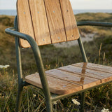 Olive Kirra Patio Chair with teak wood seat and powder-coated aluminum frame in outdoor setting