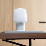 White Ambience Lamp Intelligent+ with London base in small size on a light surface