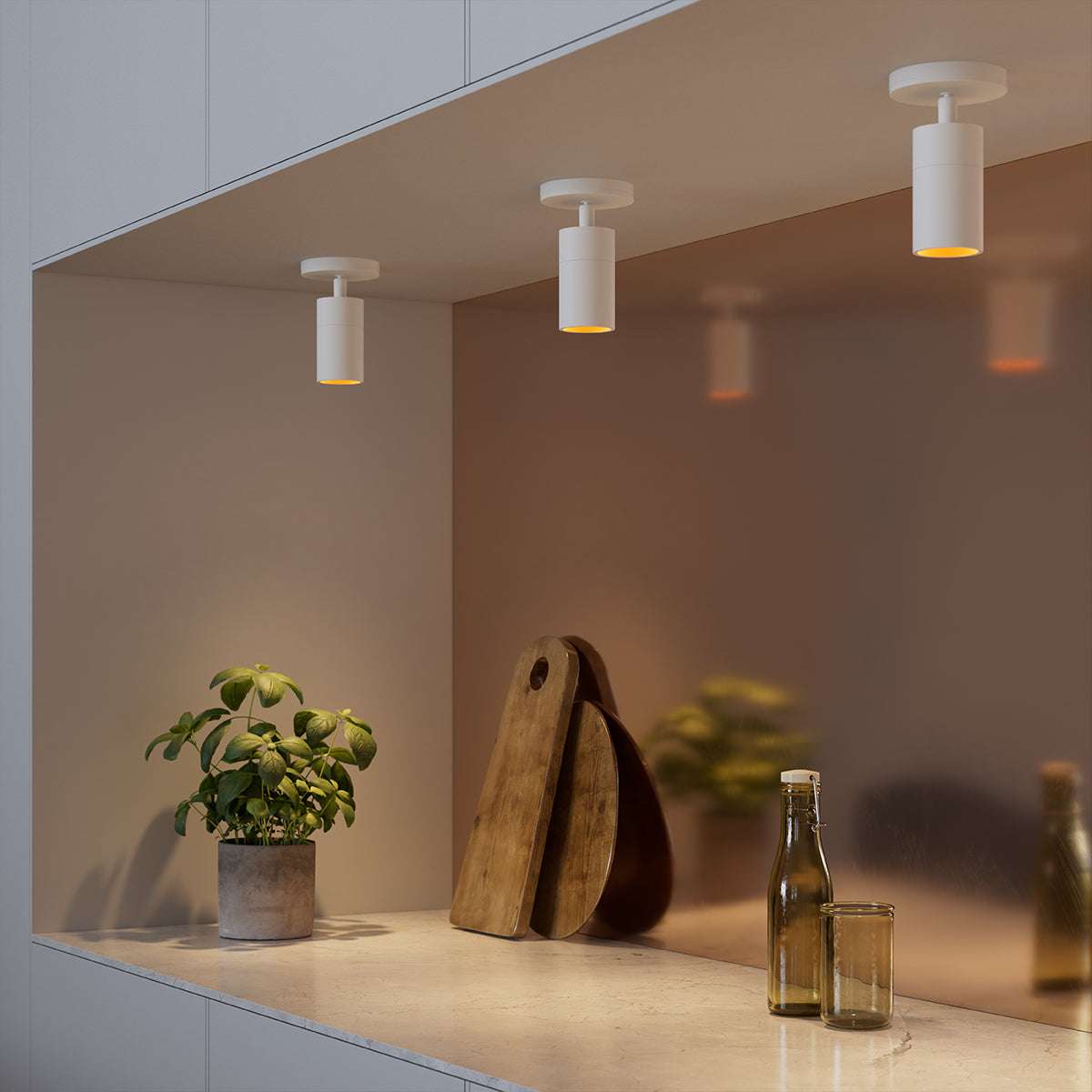White aluminum Expo Ceiling light with a simple round design mounted on a ceiling.