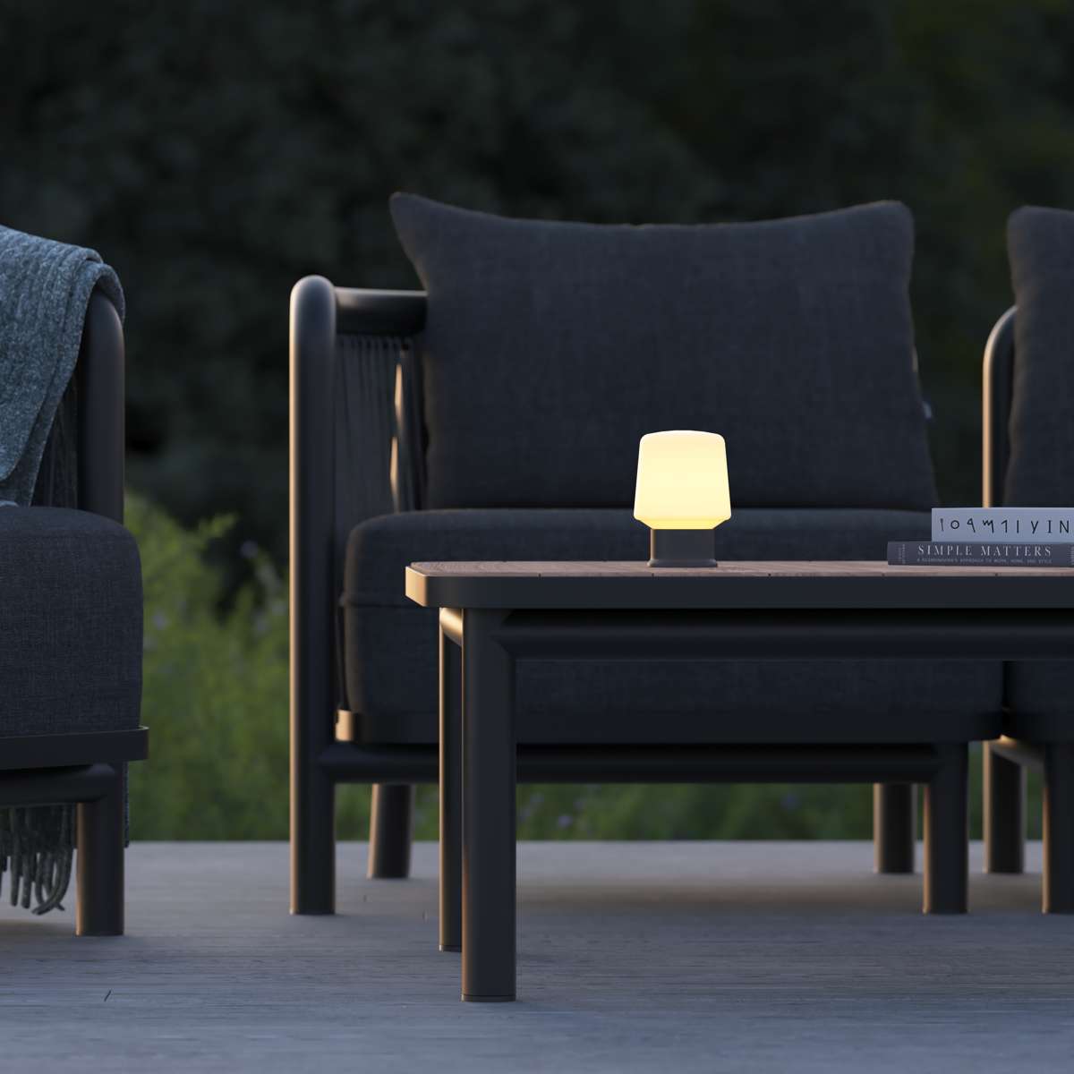 Ambience Lamp Intelligent+ in anthracite with compact design, suitable for indoor and outdoor use, shown lit on a dark surface