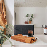 Move 150 speaker front panel in dark gray Fiord fabric by Kvadrat, rectangular shape.