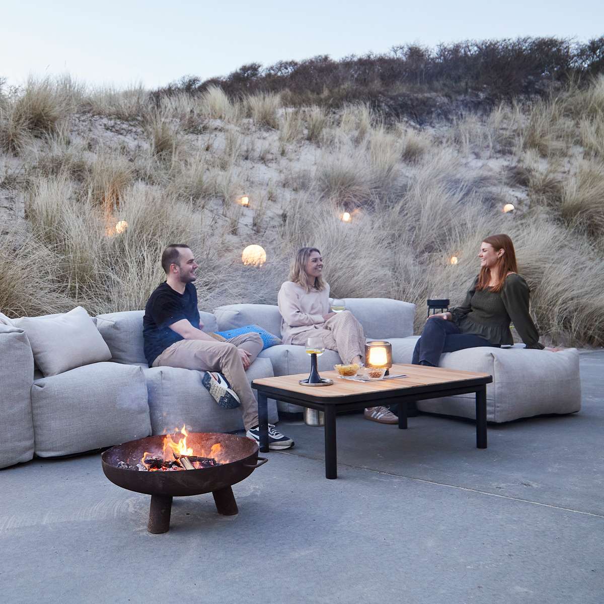 Soft Sofa Outdoor lounger in Kirra Sand fabric with soft cushions on a light background