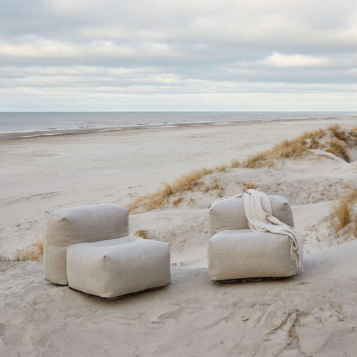 Soft Sofa Outdoor 3-seater with lounger in Kirra Sand fabric on a light background
