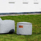 Cobana Junior Pouf in Cobana Sand Melange color with round shape and soft fabric texture.