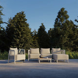 Kirra Lounge Chair in sand color with powder-coated aluminum frame and Olefin textile upholstery