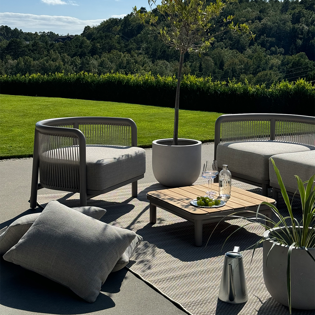 Kirra Lounge Sofa 2-seater in Kirra Sand with powder-coated aluminum frame and Olefin cushions outdoors