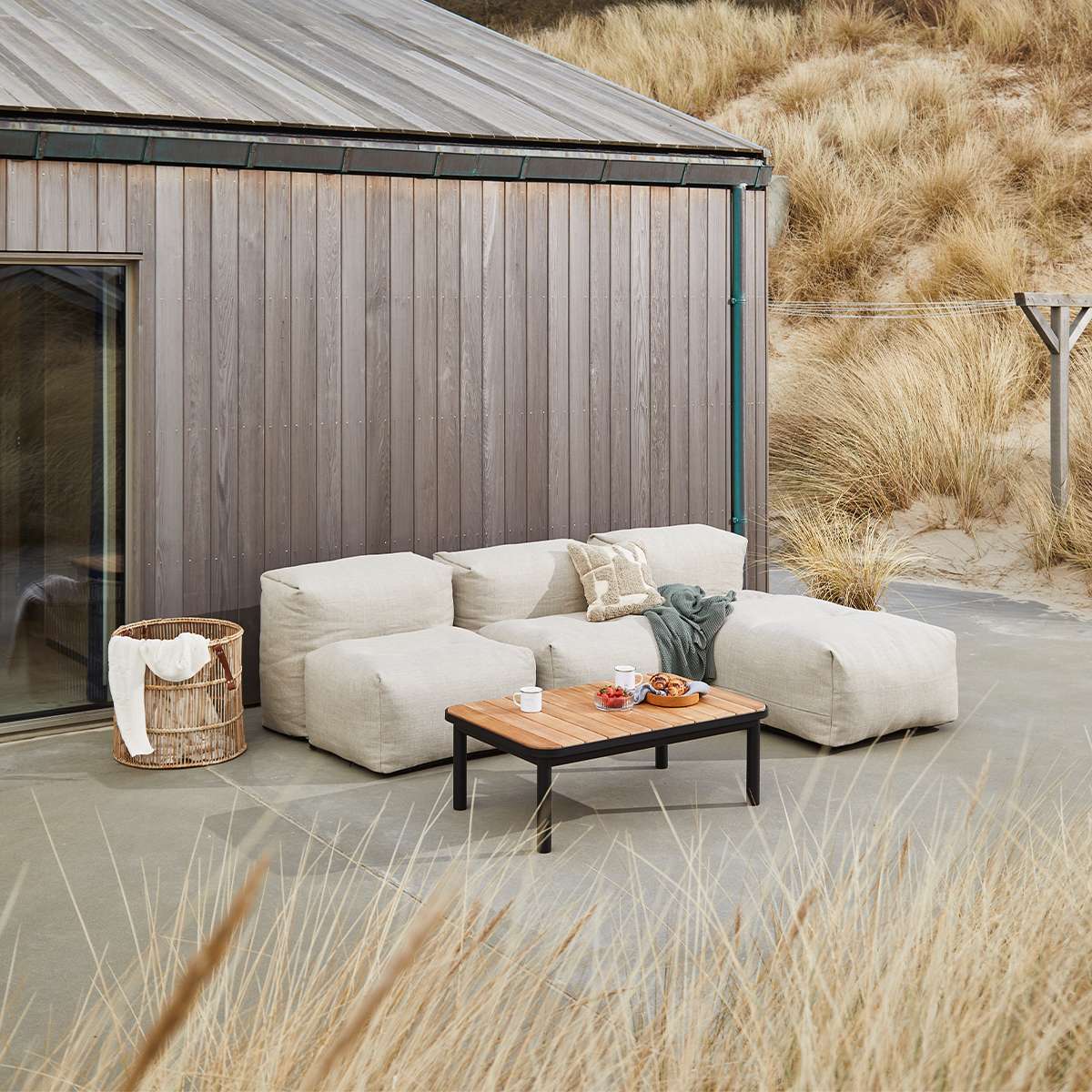 Kirra Coffee Table outdoor sofa table with teak wood top and powder-coated aluminum frame in black finish