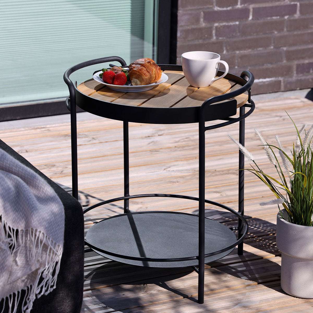 Matte powder-coated stainless steel outdoor patio serving table with curved rods and steel plate top