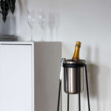 Patio Accessory Stand and Wine Cooler in stainless steel with a simple, geometric design.