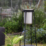 Stainless steel Patio Accessory Stand with Wine Cooler in a simple geometric design outdoors