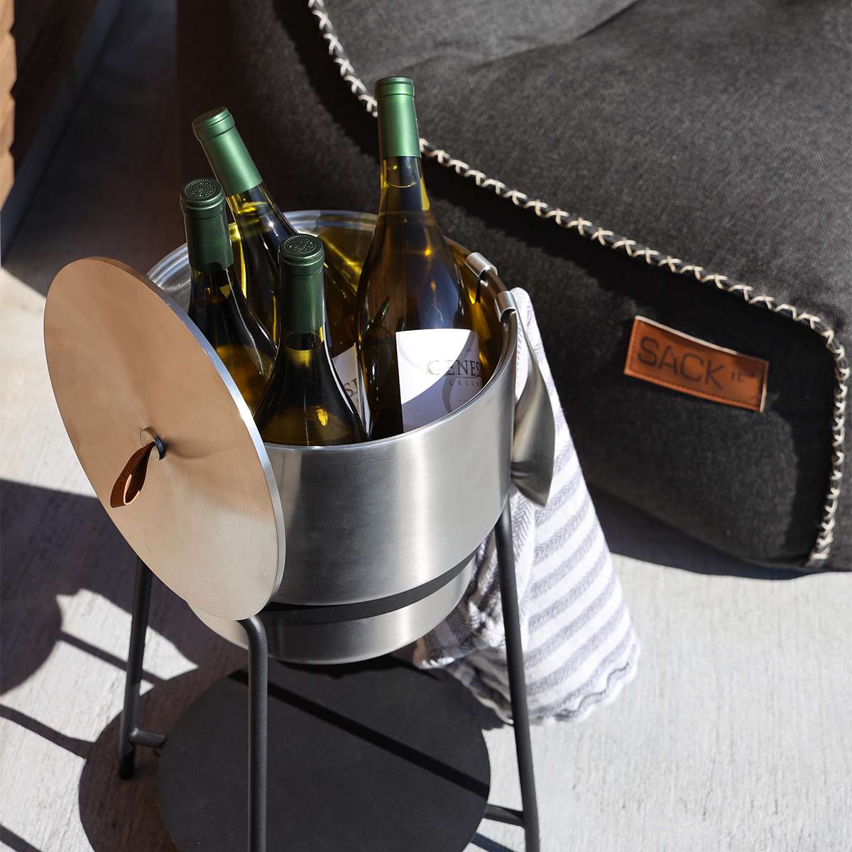 Stainless steel wine bucket with accessories on a white background, round shape, 27x23 cm size.