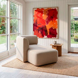 sackit Fjord Sofa chaise in soft beige upholstery with rounded arms styled on a natural rug in a bright Scandinavian living room with abstract art