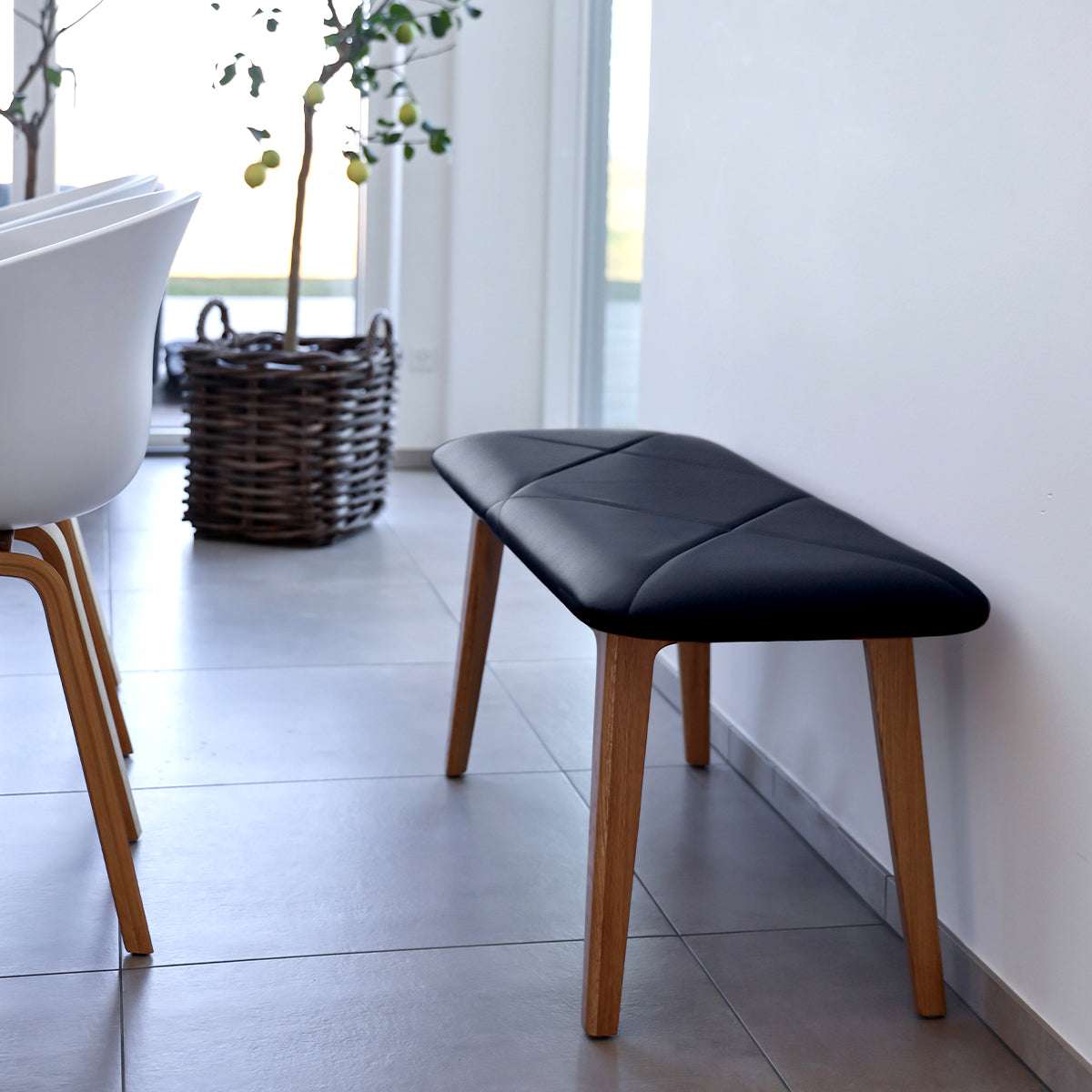 Nordic Bench in solid oak with Terra Black leather seat, sleek and minimalist design.