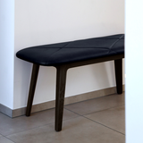 Nordic Bench in dark stained oak with Terra Black leather seat in a simple setting