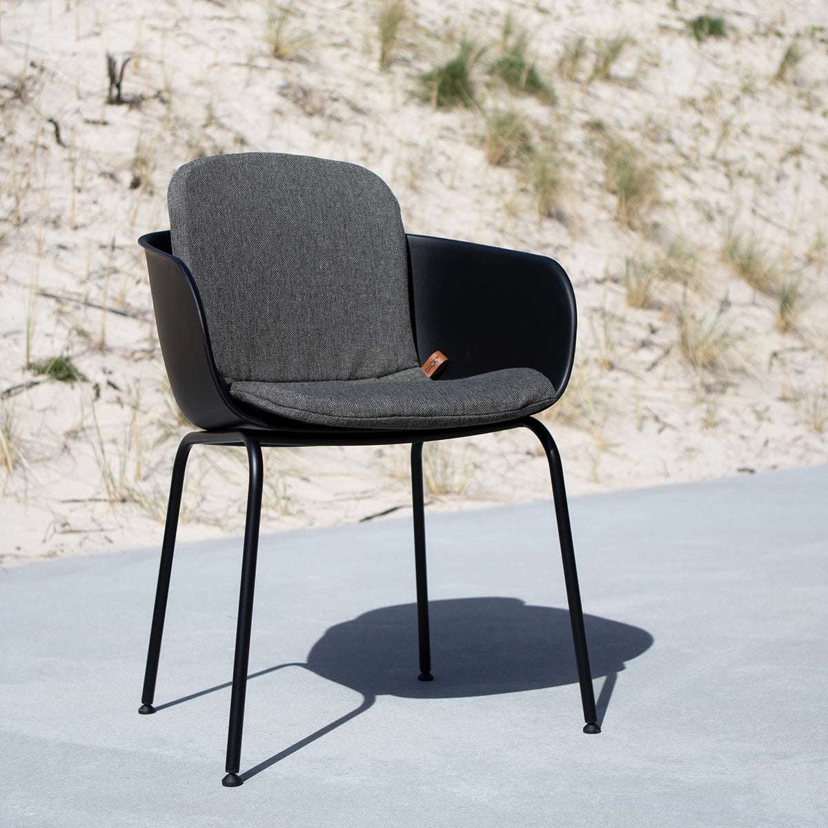 Cobana Grey slipover cushion on Patio Chair no. One designed for outdoor use with non-slip backing.