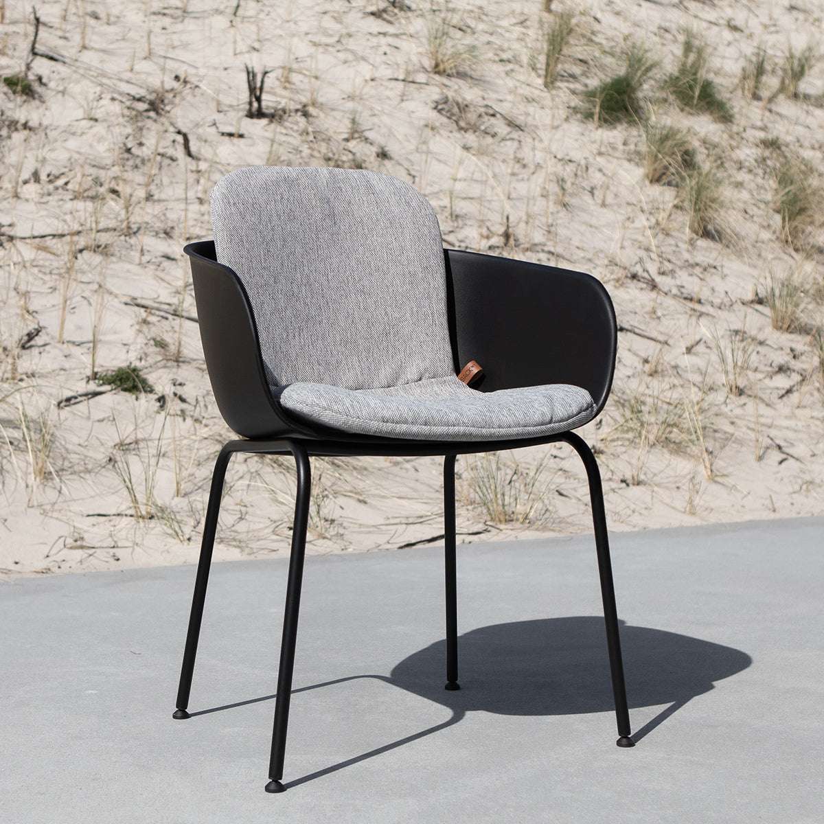 Cobana Sand Melange slipover cushion on Patio Chair no. One in outdoor setting