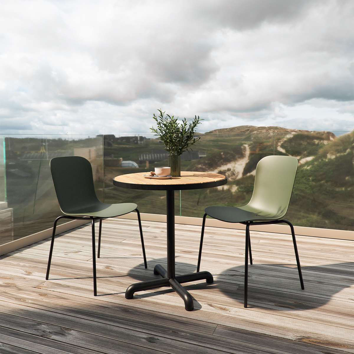 Olive green molded plastic patio chair with black powder-coated steel frame on outdoor terrace