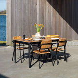 Kirra Dining Table 150x90 outdoor table with teak wood top and powder-coated aluminum frame in natural setting