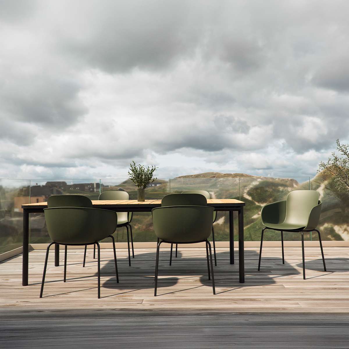 Outdoor Kirra Dining Table with teak wood top and powder-coated aluminum frame in a natural setting