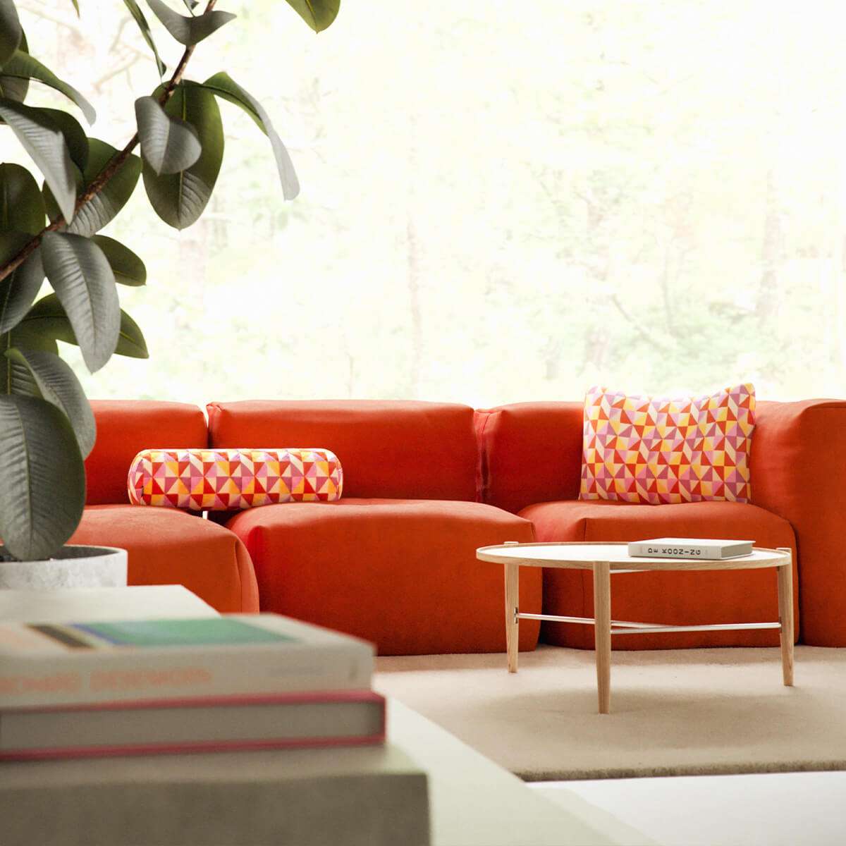 Soft Sofa Indoor lounger in orange jacquard fabric with geometric pattern on a light background
