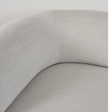 Close up of soft textured light beige upholstery and a curved corner seam on the Fjord sofa by sackit