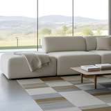 sackit Fjord corner sofa with open end in a calm Scandinavian living room beside a wood coffee table and large windows overlooking a green landscape